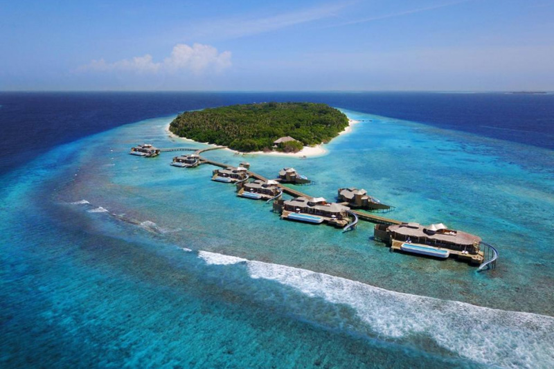 maldives beach hut with slide